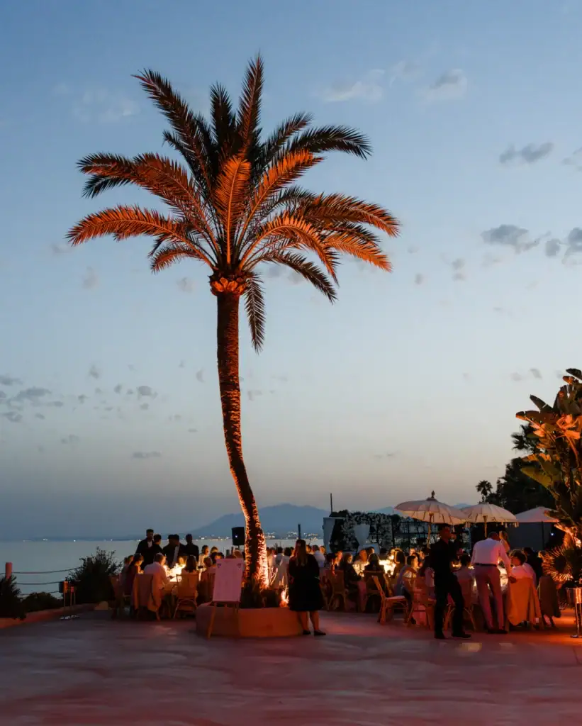 La Cabane beach club in Marbella at golden hour, a seaside wedding venue with palm trees